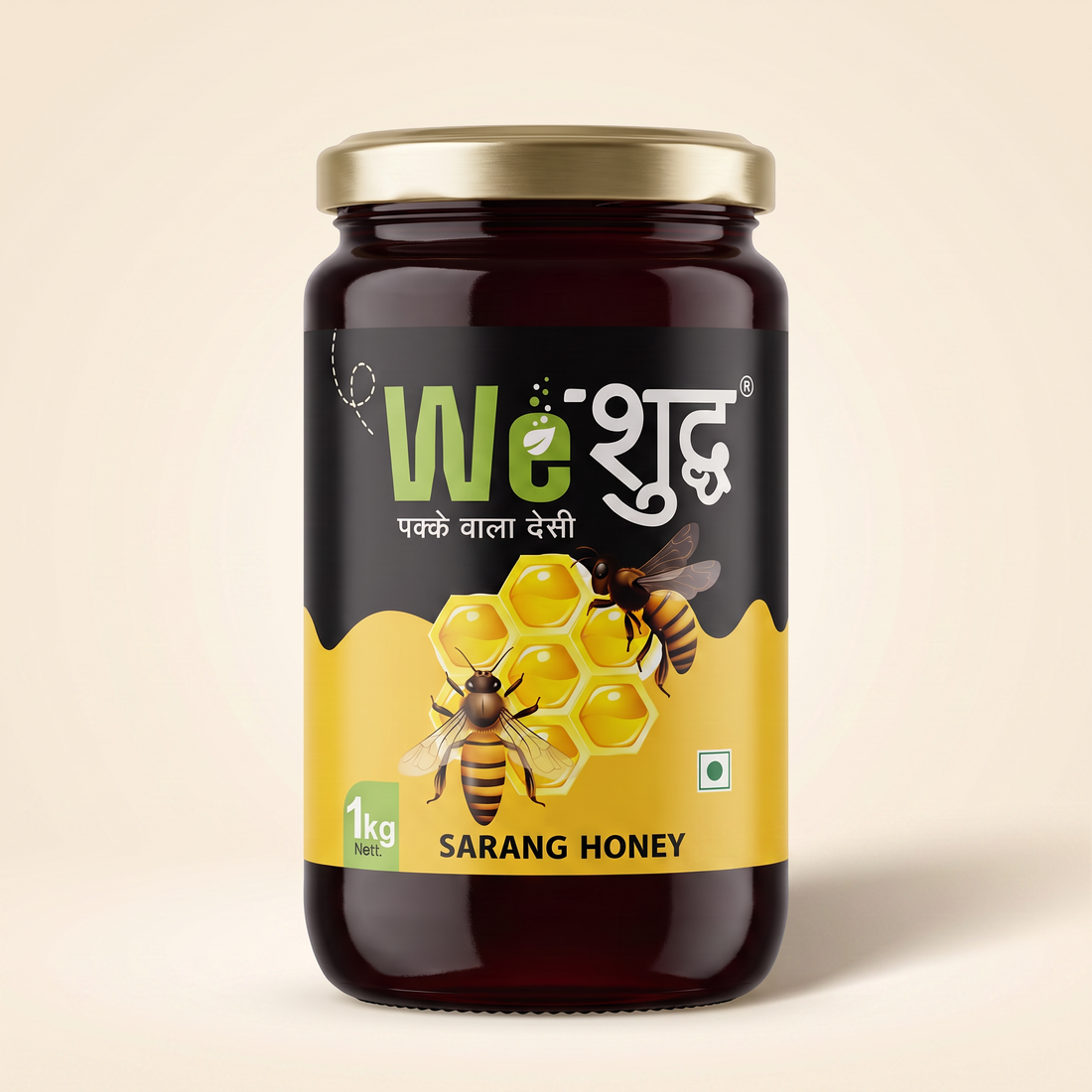WeShuddhs Sarang Honey 1 kg glass jar with gold metal lid and near-black raw honey, on a warm cream background.