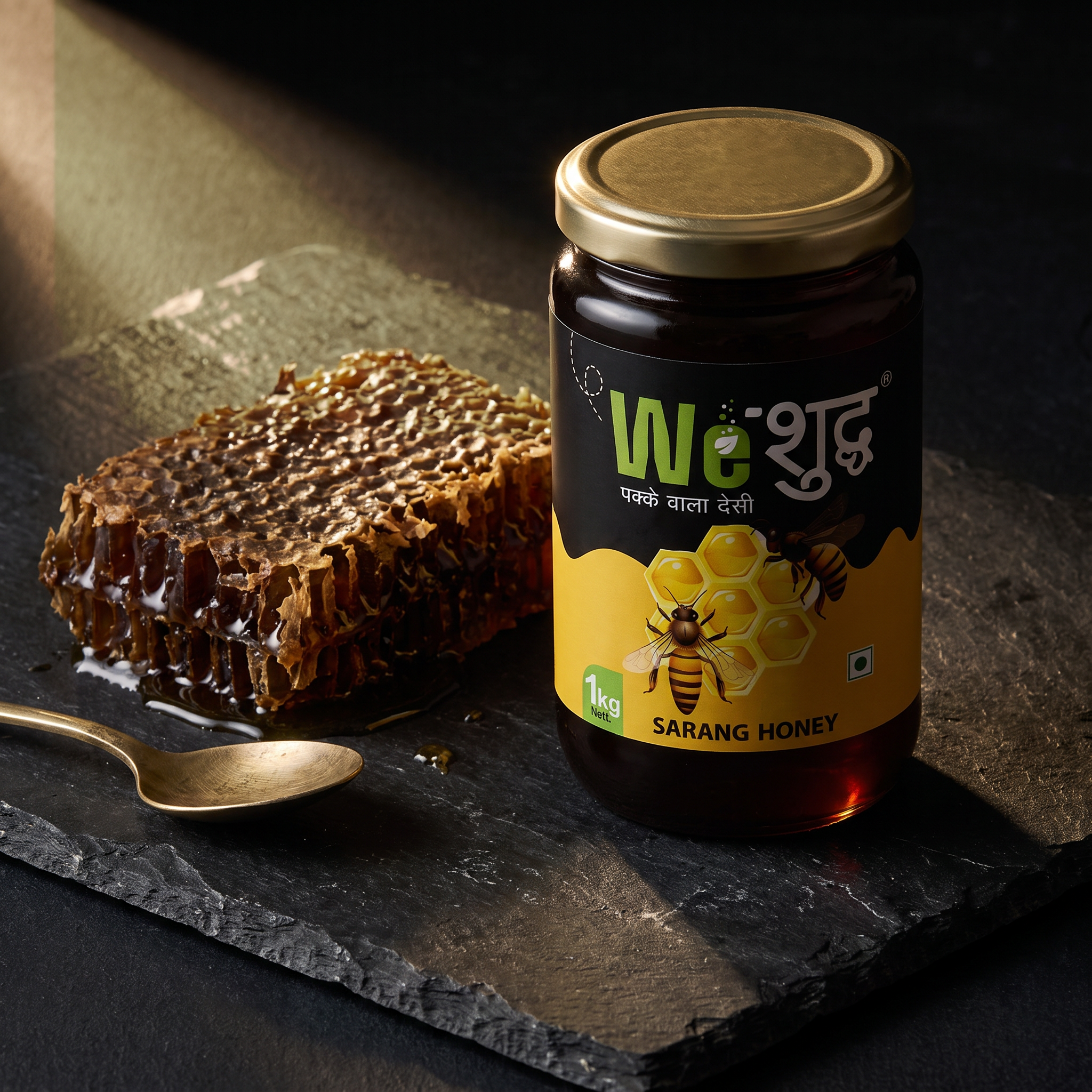 WeShuddhs Sarang Honey jar on dark slate with a slab of raw wild honeycomb and a brass spoon.