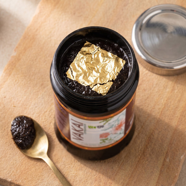 Open jar of Vakai Chyawanprash with gold varq on top