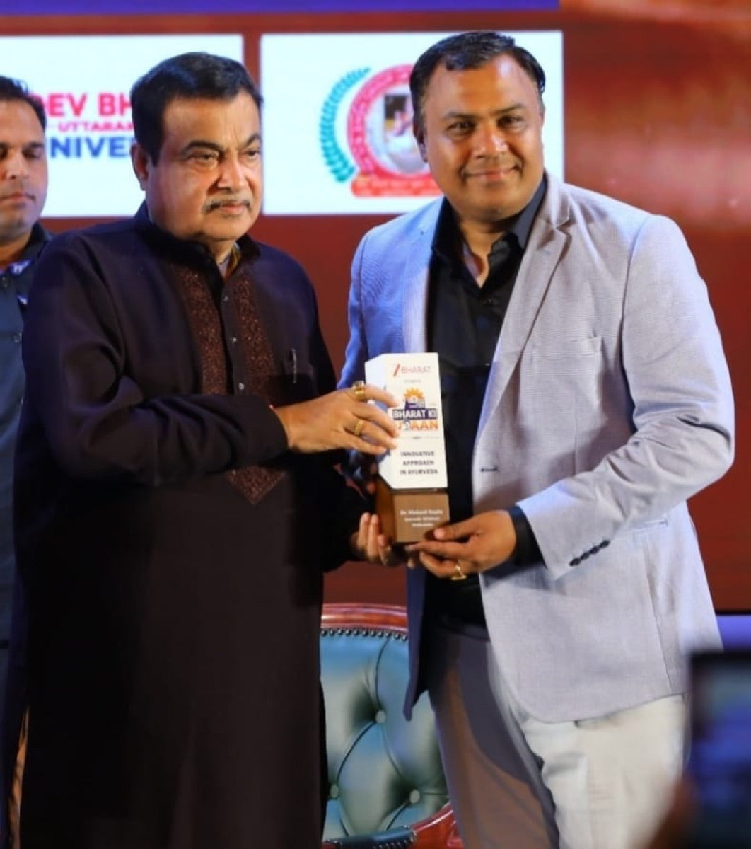 Receiving the 'Bharat Ki Shaan' honour for Innovative Approach in Ayurveda from Union Minister Nitin Gadkari